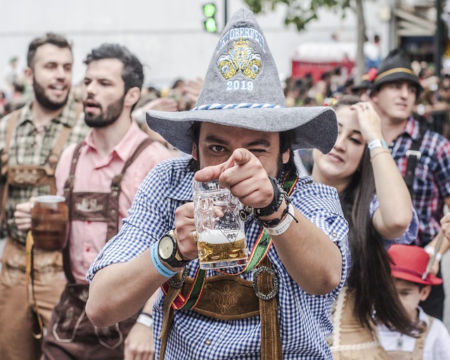 man with beer and grey hat